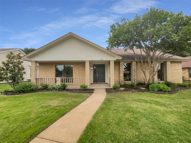 view of front of house with covered porch and a front lawn