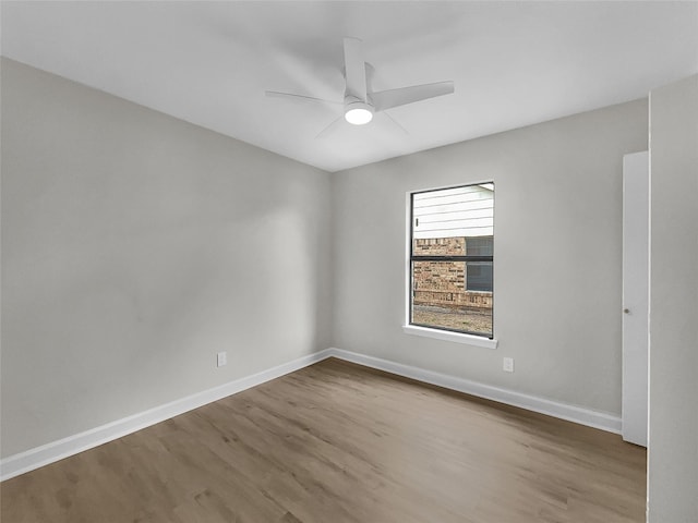 unfurnished room featuring hardwood / wood-style floors and ceiling fan