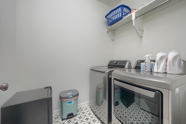 washroom with washing machine and dryer