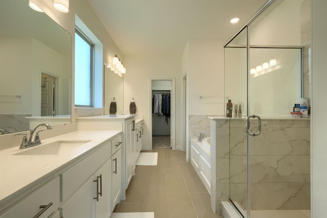 bathroom featuring tile patterned floors, vanity, and plus walk in shower