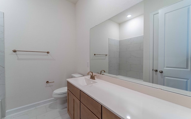 bathroom featuring tile flooring, vanity with extensive cabinet space, and toilet