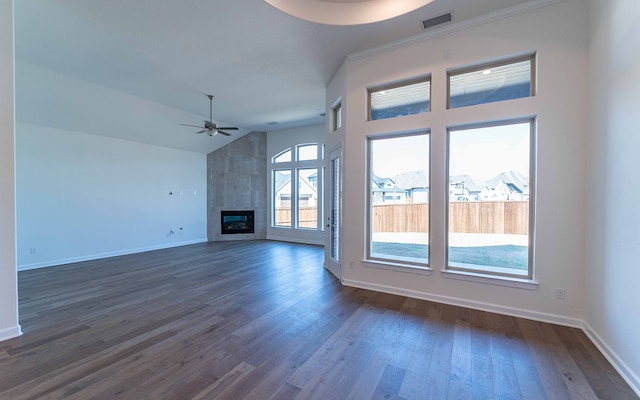 unfurnished living room featuring high vaulted ceiling, ceiling fan, dark hardwood / wood-style flooring, and a large fireplace