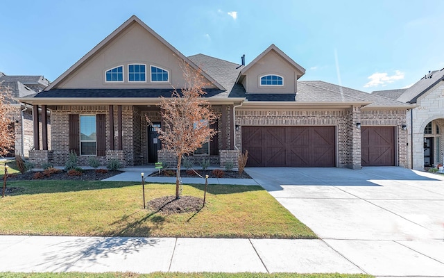 view of front of home featuring a garage and a front yard