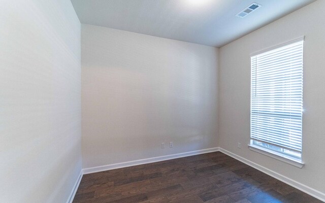 spare room featuring hardwood / wood-style flooring