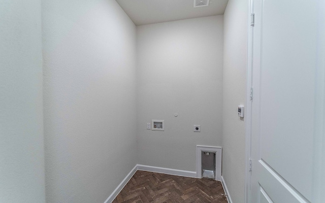 laundry area with hookup for a washing machine, dark parquet flooring, electric dryer hookup, and hookup for a gas dryer