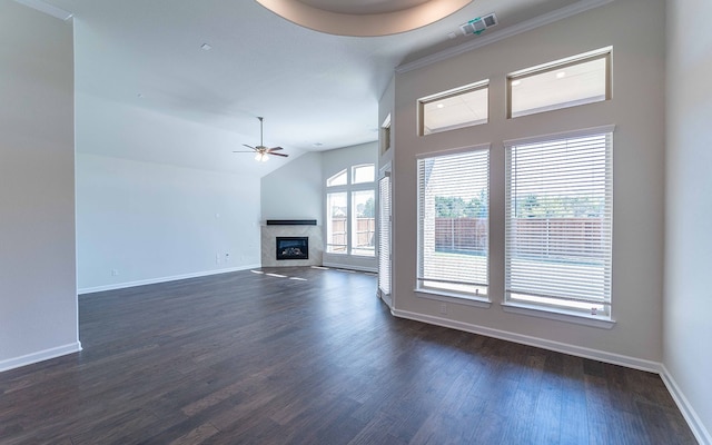 unfurnished living room featuring a premium fireplace, ceiling fan, vaulted ceiling, and dark wood-type flooring