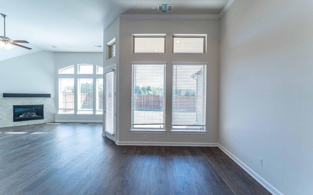 unfurnished living room featuring crown molding, lofted ceiling, ceiling fan, and dark hardwood / wood-style flooring