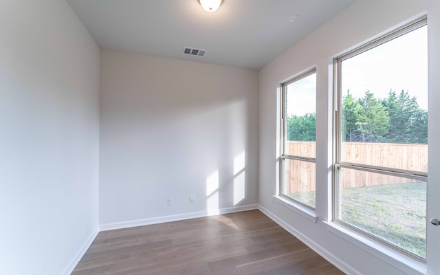 empty room with dark hardwood / wood-style floors