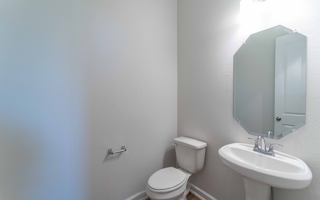 bathroom with sink and toilet