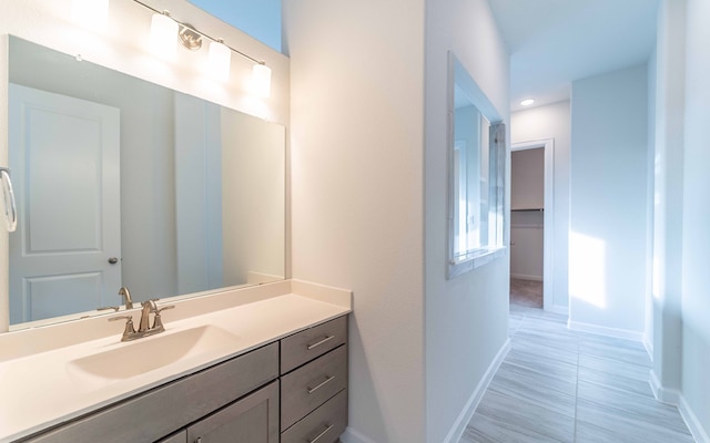 bathroom with tile floors and vanity