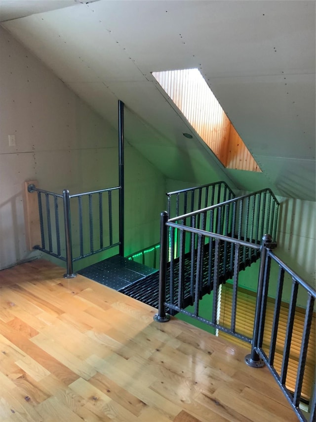 bonus room featuring hardwood / wood-style flooring and lofted ceiling