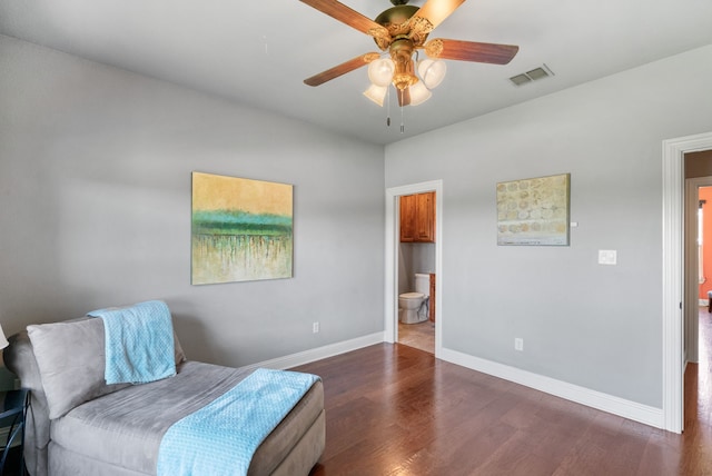 living area featuring dark hardwood / wood-style floors and ceiling fan