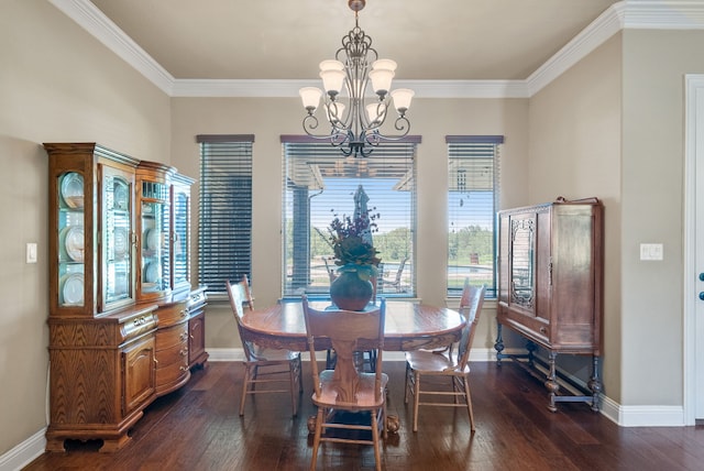 dining room featuring ornamental molding, dark wood-type flooring, and a notable chandelier