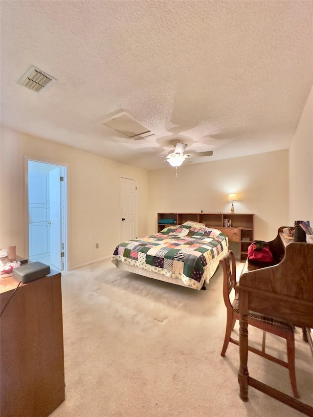 bedroom featuring carpet, a textured ceiling, and ceiling fan