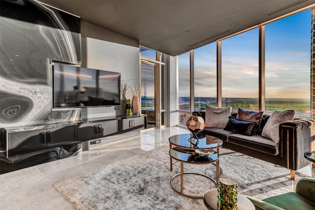 living room featuring floor to ceiling windows and tile flooring