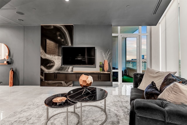 tiled living room with floor to ceiling windows