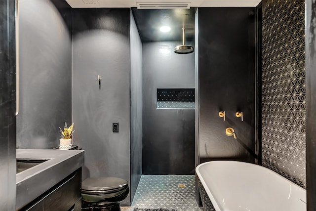 bathroom with tile flooring, a washtub, and toilet