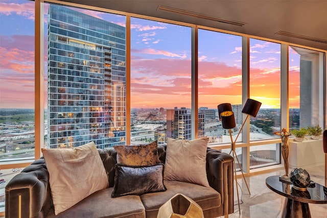 tiled living room with a wall of windows