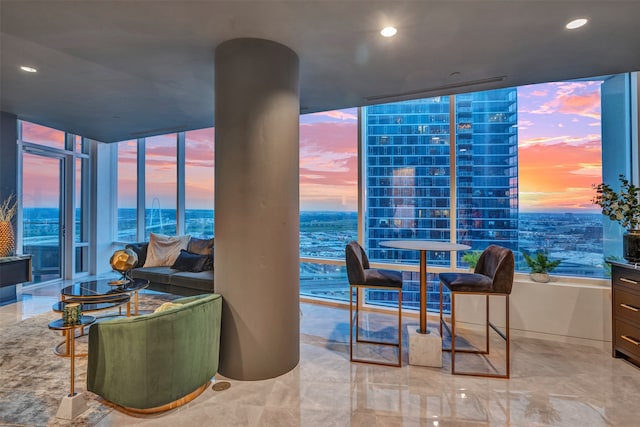 tiled living room with a water view