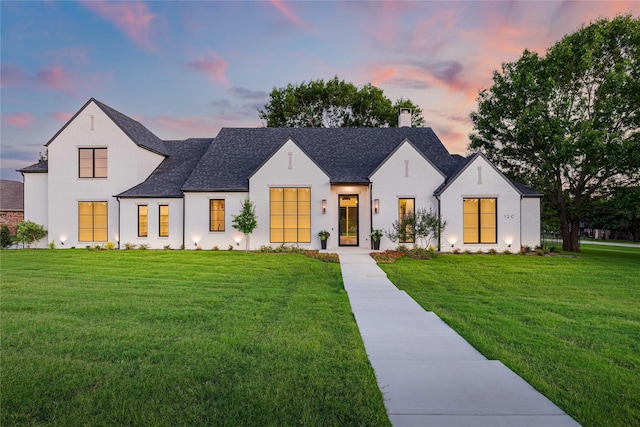 modern farmhouse style home with a yard