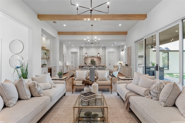 living room with beamed ceiling, ceiling fan with notable chandelier, and built in features