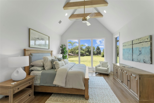 bedroom with beamed ceiling, light hardwood / wood-style flooring, high vaulted ceiling, and multiple windows