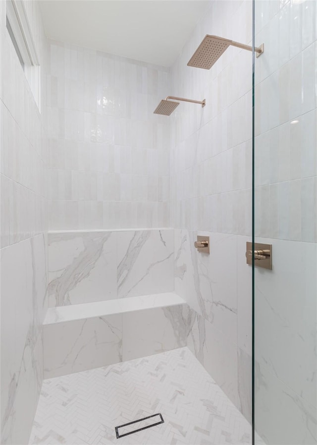 bathroom with tiled shower