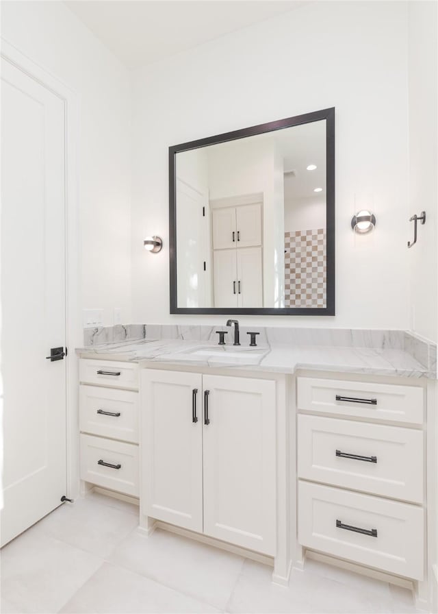 bathroom featuring tile patterned floors and vanity