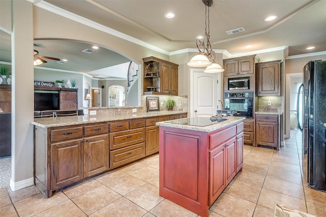 kitchen featuring visible vents, a center island, a peninsula, black appliances, and open shelves