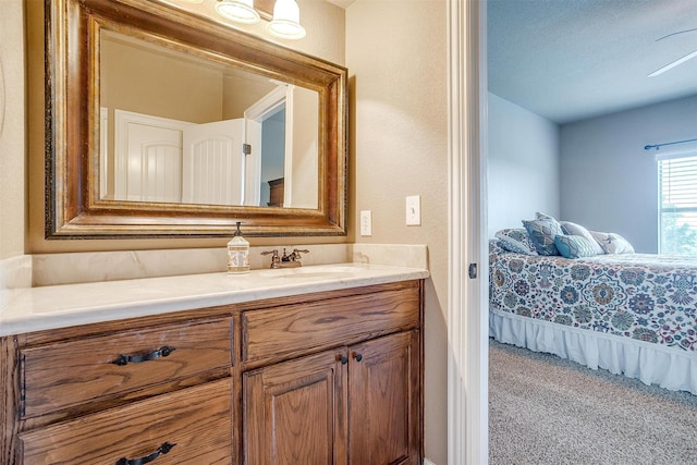 bathroom featuring lofted ceiling, ensuite bath, and vanity