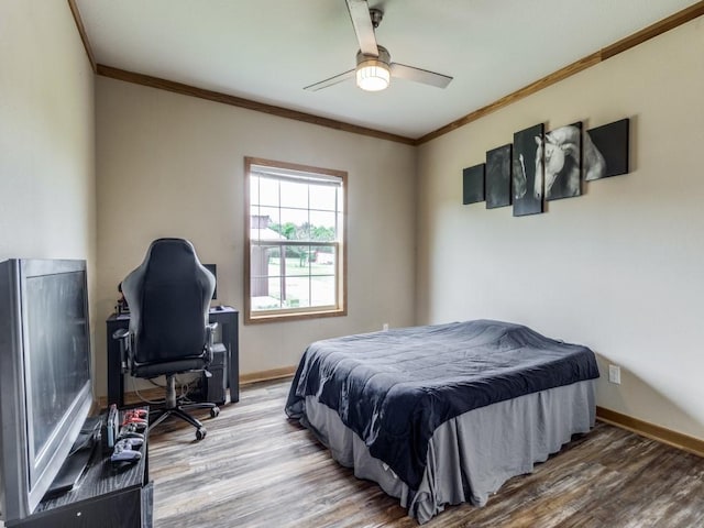 bedroom with ceiling fan, ornamental molding, and hardwood / wood-style flooring