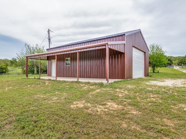 garage featuring a lawn