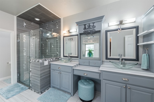 bathroom with tile patterned flooring, vanity, and walk in shower