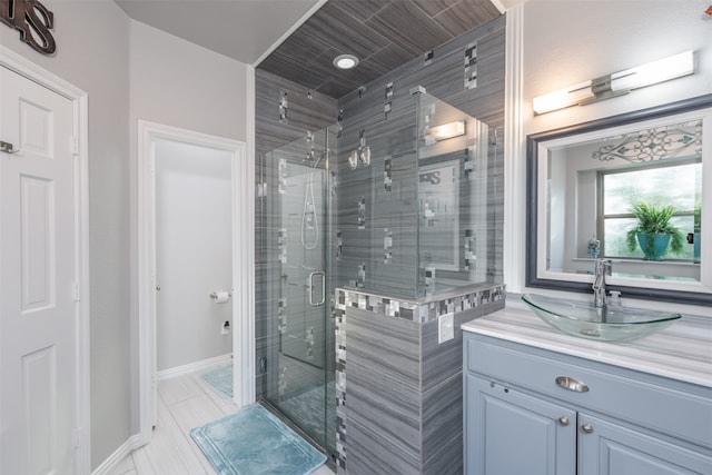 bathroom with vanity and walk in shower