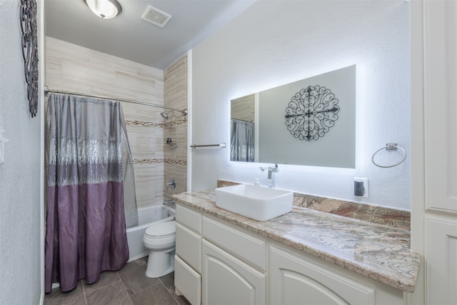 full bathroom with toilet, vanity, and shower / tub combo with curtain