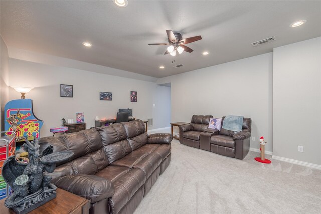 living room featuring light carpet and ceiling fan