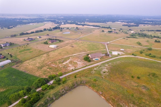 bird's eye view with a rural view and a water view