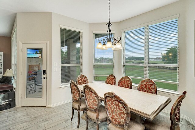 carpeted bedroom with multiple windows, a tray ceiling, and ceiling fan