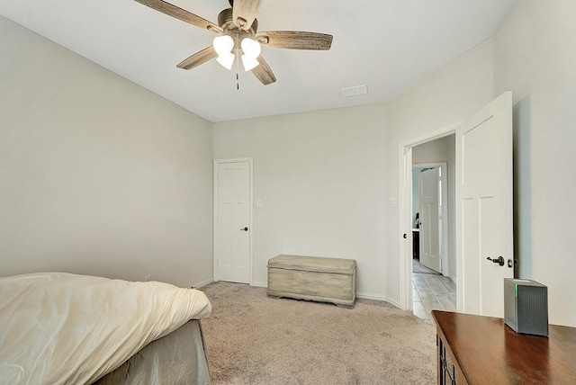 carpeted bedroom with ceiling fan