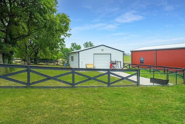 view of outbuilding with a yard and a garage