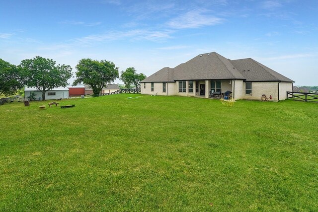 view of yard with a rural view