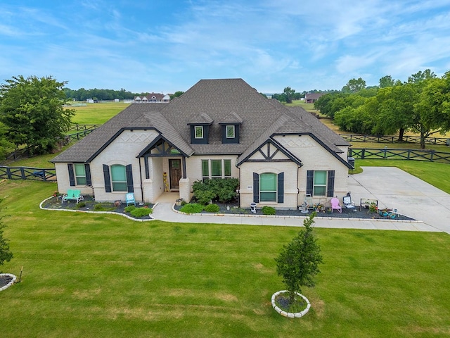 french provincial home featuring a front lawn