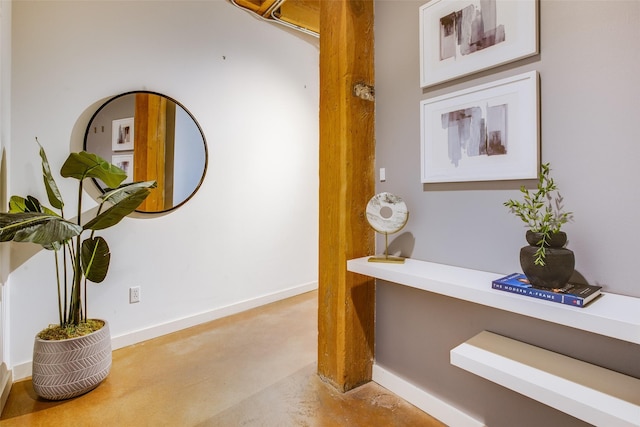 hallway with concrete flooring