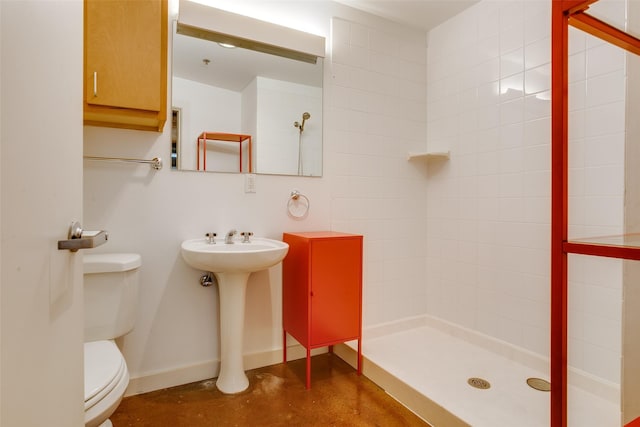 bathroom featuring concrete floors, a shower, and toilet