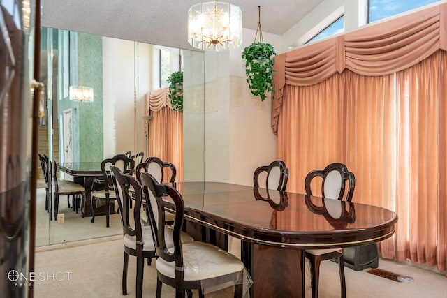 dining area featuring a textured ceiling and an inviting chandelier