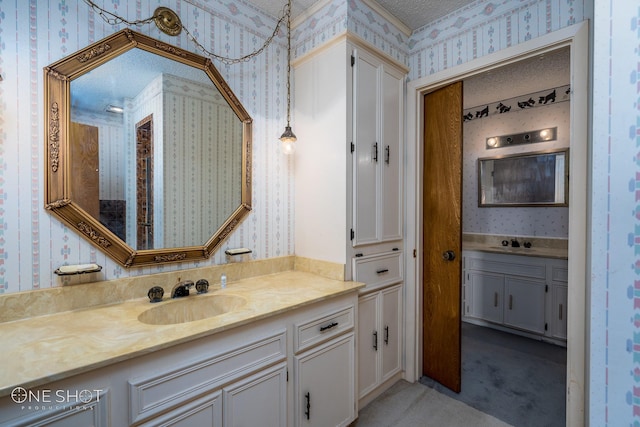 bathroom featuring vanity and a textured ceiling