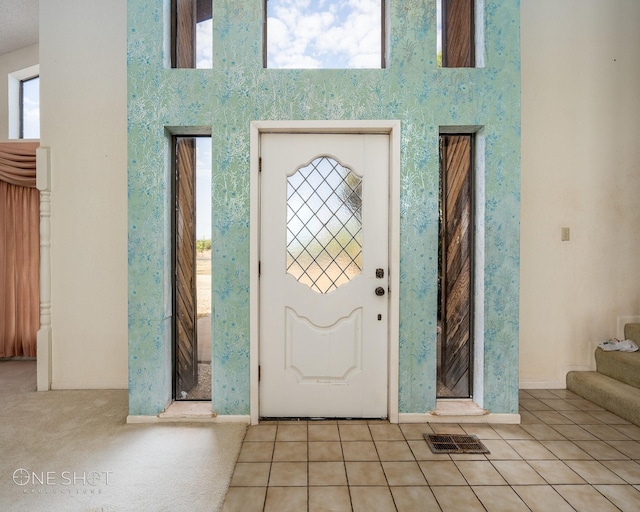 foyer with light tile patterned flooring