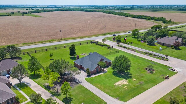birds eye view of property with a rural view