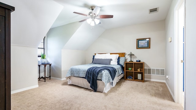 bedroom featuring vaulted ceiling, ceiling fan, and light colored carpet