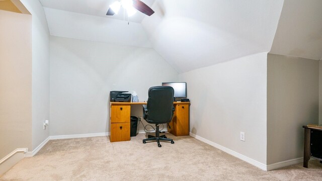 office space featuring ceiling fan, light colored carpet, and vaulted ceiling